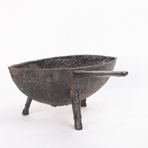 316 - A 17th or 18th century cast-iron grisset pan, possibly Irish or Sussex, the bowl of pointed oval for... 
