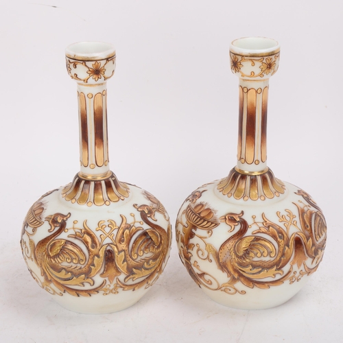 319 - A pair of Victorian milk glass narrow-neck vases, thick gilded relief painted phoenix designs, heigh... 