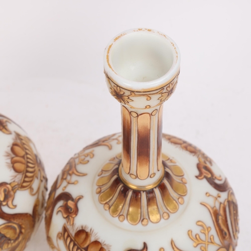 319 - A pair of Victorian milk glass narrow-neck vases, thick gilded relief painted phoenix designs, heigh... 