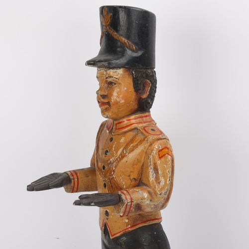 321 - A carved and painted wood bellboy business card holder, early 20th century, height 55cm
