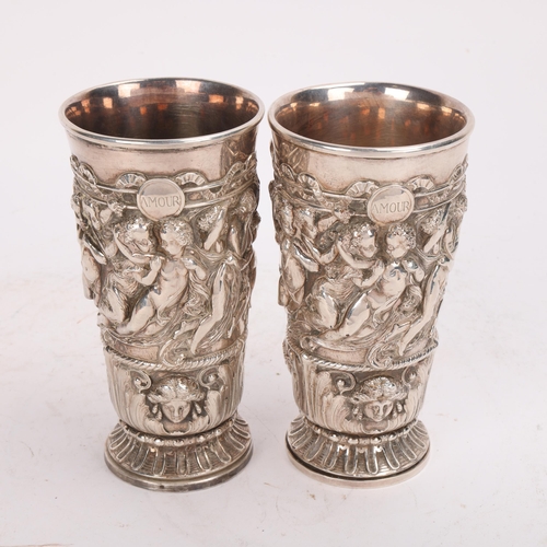 322 - A pair of 19th century electroplate Neo-Classical design cups or vases, decorated in high relief wit... 