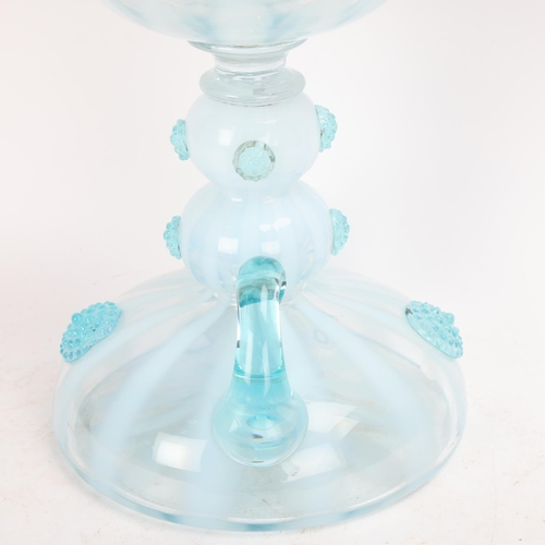 330 - **CONDITION REPORT CHANGE** A Victorian pale blue and white glass oil lamp, with applied glass bosse... 