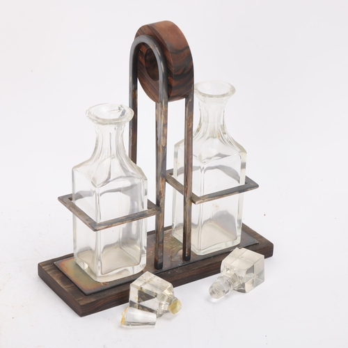 331 - An Art Deco 2-bottle cruet stand, coromandel electroplate and cut-glass, height 19cm