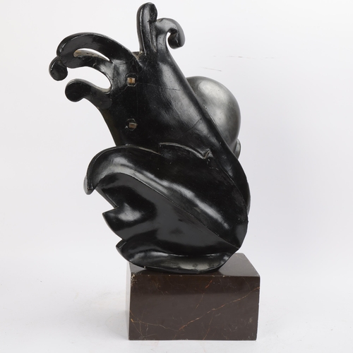 335 - An Art Deco carved stained wood stylised head, in the manner of Margarete Moll, with carved and pain... 