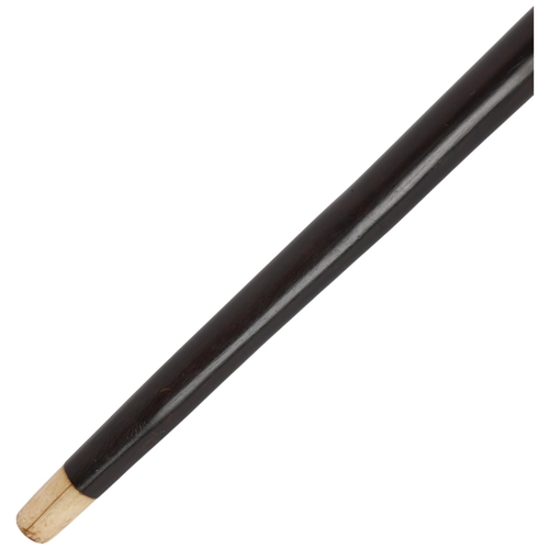 352 - A carved hardwood cane, with geometric decoration and bone ferrule
