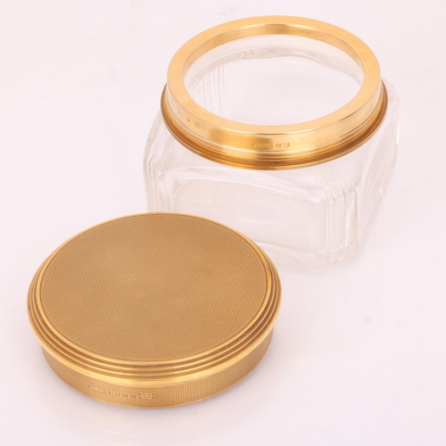 1124 - ASPREY - an Art Deco 18ct gold mounted glass 8-piece dressing table toilet jar set, London 1929, com... 