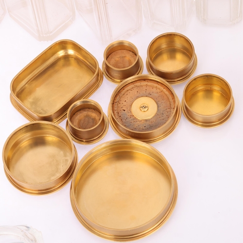 1124 - ASPREY - an Art Deco 18ct gold mounted glass 8-piece dressing table toilet jar set, London 1929, com... 