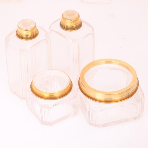 1124 - ASPREY - an Art Deco 18ct gold mounted glass 8-piece dressing table toilet jar set, London 1929, com... 
