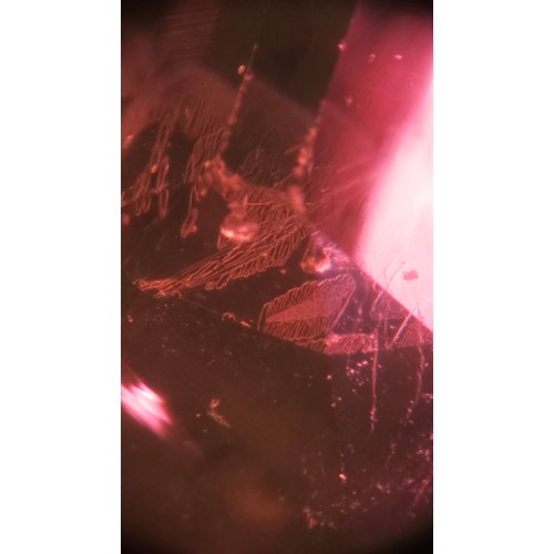 1120 - A fine 18ct gold ruby and diamond cluster ring, claw set with 2.5ct oval mixed-cut ruby surrounded b... 