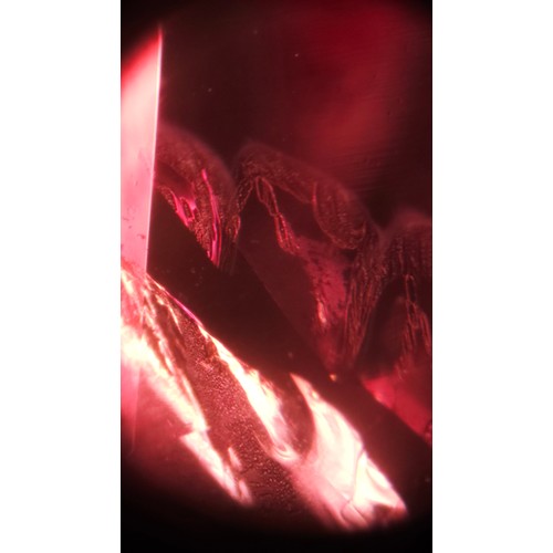 1120 - A fine 18ct gold ruby and diamond cluster ring, claw set with 2.5ct oval mixed-cut ruby surrounded b... 