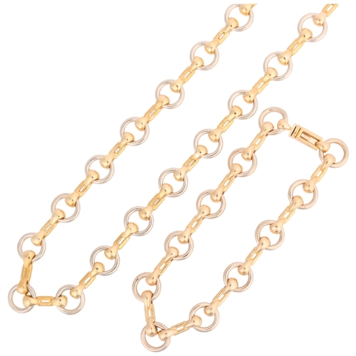 1110 - CARTIER - a Vintage 18ct two-colour gold snaffle horsebit link chain necklace and bracelet set, both... 