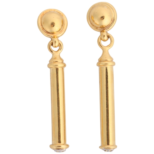 1111 - THEO FENNELL - a pair of 18ct gold 'Shaft' drop stud earrings, the plain polished drop signed with T... 