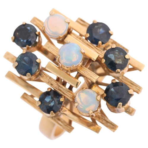 1335 - A Continental 14ct gold opal and sapphire abstract ring, set with round cabochon opal, round-cut tur... 