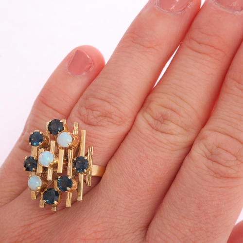 1335 - A Continental 14ct gold opal and sapphire abstract ring, set with round cabochon opal, round-cut tur... 