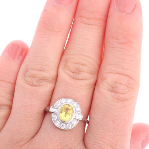 1345 - An Art Deco style platinum yellow sapphire and diamond cluster panel ring, millegrain set with oval ... 