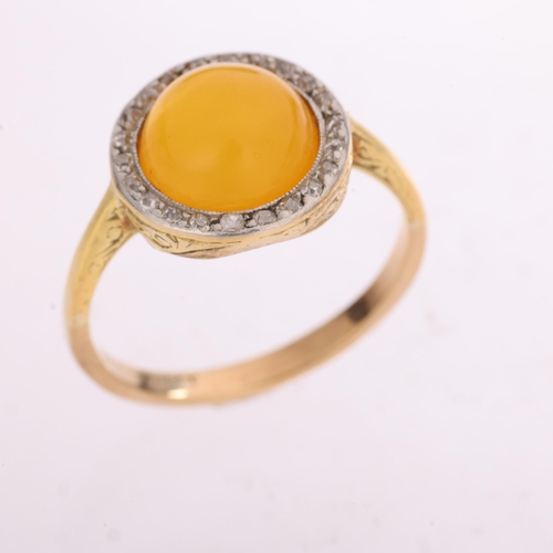 1348 - An 18ct gold amber and diamond cluster ring, platinum-topped set with round cabochon amber surrounde... 