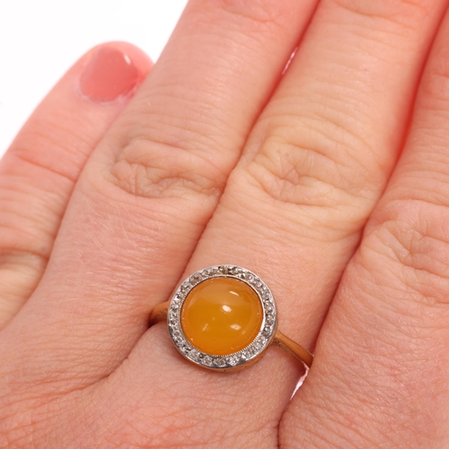 1348 - An 18ct gold amber and diamond cluster ring, platinum-topped set with round cabochon amber surrounde... 
