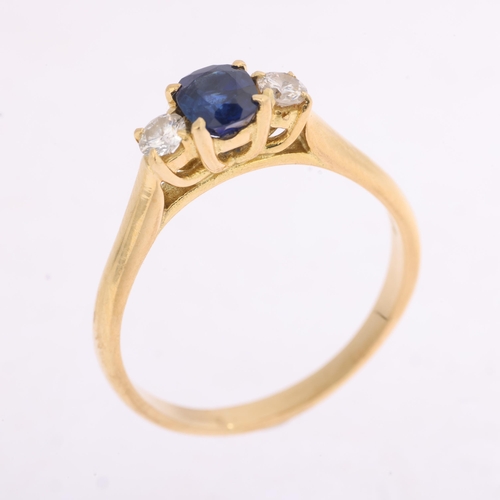 1349 - An 18ct gold three stone sapphire and diamond ring, indistinct hallmarks, set with 0.55ct oval cushi... 