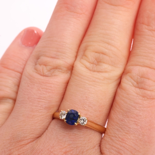 1349 - An 18ct gold three stone sapphire and diamond ring, indistinct hallmarks, set with 0.55ct oval cushi... 