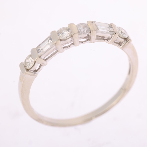 1350 - A 14ct white gold diamond half eternity ring, bar set with modern round brilliant and baguette-cut d... 