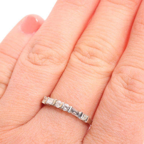 1350 - A 14ct white gold diamond half eternity ring, bar set with modern round brilliant and baguette-cut d... 