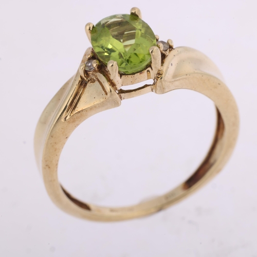 1351 - A 9ct gold three stone peridot and white sapphire dress ring, claw set with oval mixed-cut peridot, ... 
