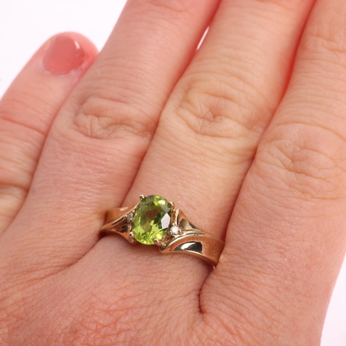 1351 - A 9ct gold three stone peridot and white sapphire dress ring, claw set with oval mixed-cut peridot, ... 