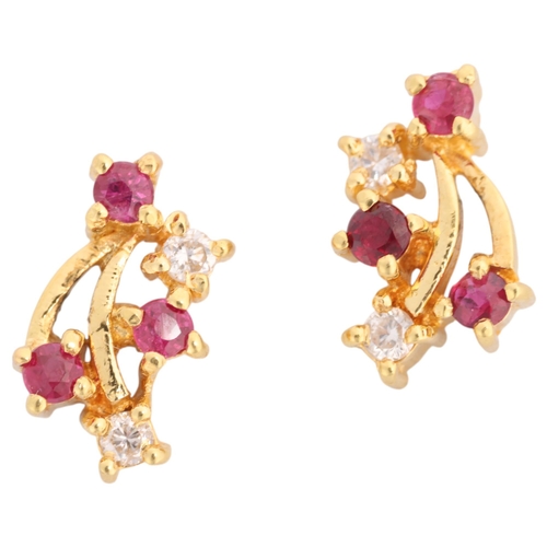1354 - A pair  of 18ct gold ruby and diamond stud earrings, set with round-cut rubies and modern round bril... 