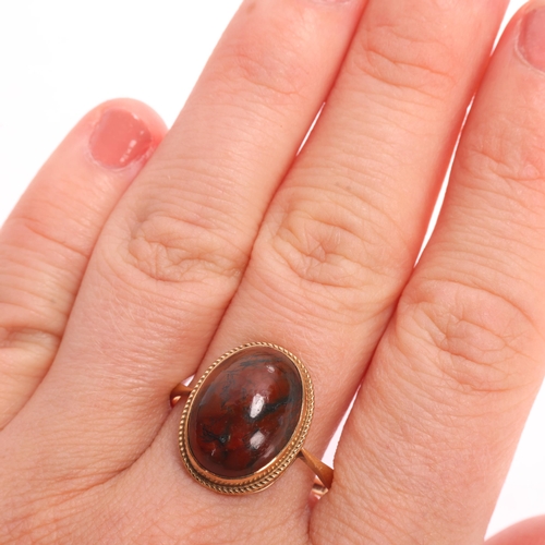 1356 - A 9ct gold moss agate dress ring, maker FKB Ltd, Birmingham 1971, rub-over set with oval cabochon mo... 