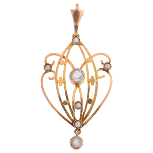 1364 - An Art Nouveau Edwardian 9ct rose gold aquamarine and split pearl openwork pendant, 47mm, 2.2g