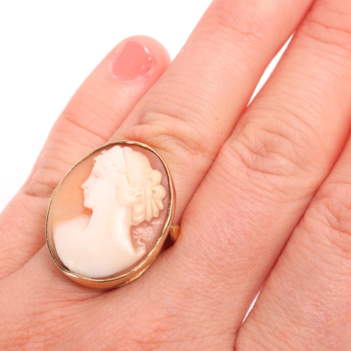 1367 - A 9ct gold shell cameo panel ring, maker L&W, Birmingham 1963, the oval panel relief carved depictin... 