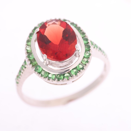 1368 - An 18ct white gold Mozambique garnet and chrome diopside halo cluster ring, claw set with oval mixed... 