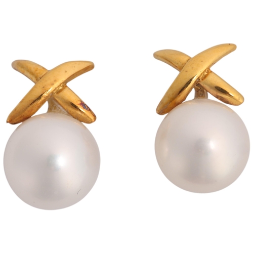 1377 - A pair of 9ct gold whole cultured pearl stud earrings, set with 8.2mm pearls beneath X motif, 2.4g