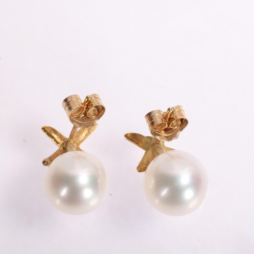 1377 - A pair of 9ct gold whole cultured pearl stud earrings, set with 8.2mm pearls beneath X motif, 2.4g