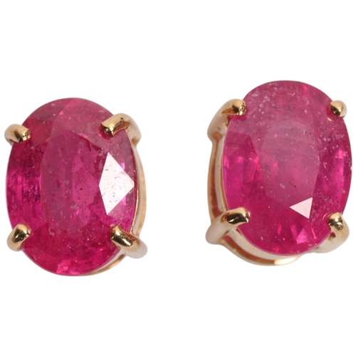 1381 - A pair of 9ct gold single stone ruby stud earrings, claw set with oval mixed-cut rubies, 7.4mm, 1.3g