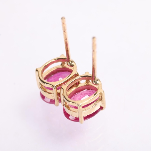 1381 - A pair of 9ct gold single stone ruby stud earrings, claw set with oval mixed-cut rubies, 7.4mm, 1.3g