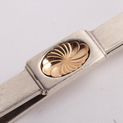 1569 - GEORG JENSEN - a Danish modernist sterling silver-gilt tie clip, designed by Henry Pilstrup, model n... 