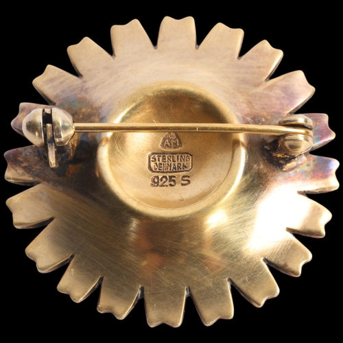 1579 - ANTON MICHELSEN - a Danish modernist sterling silver-gilt white enamel daisy pattern brooch, 32.2mm,... 