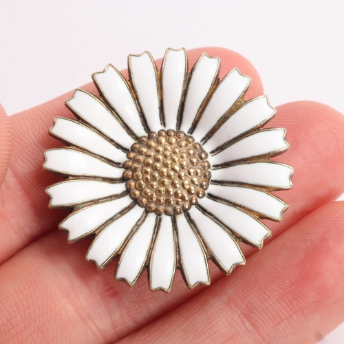 1579 - ANTON MICHELSEN - a Danish modernist sterling silver-gilt white enamel daisy pattern brooch, 32.2mm,... 