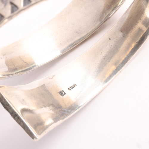 1583 - FIRMA KOPI - a Danish sterling silver Viking Revival wrap-around torque bangle, overall setting heig... 