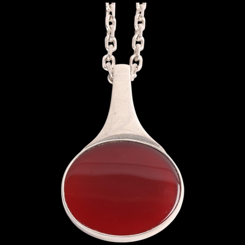 1589 - NIELS ERIK FROM - a Danish modernist sterling silver carnelian pendant necklace, plain oval form, on... 