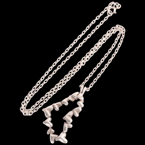 1596 - HANS HANSEN - a Danish modernist sterling silver heart pendant necklace, on sterling cable link chai... 