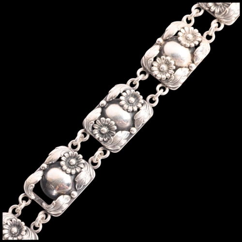 1604 - NIELS ERIK FROM - an Art Deco style Danish stylised silver floral panel bracelet, band width 14.9mm,... 