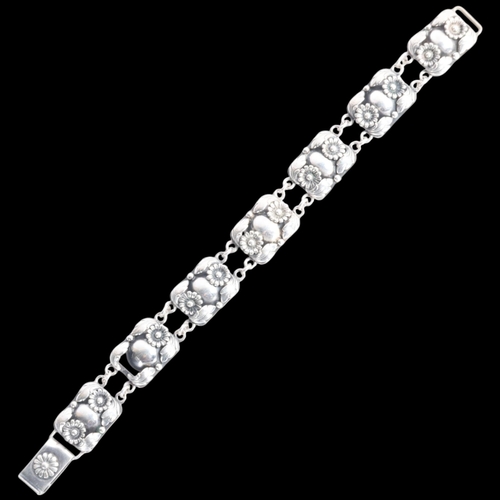 1604 - NIELS ERIK FROM - an Art Deco style Danish stylised silver floral panel bracelet, band width 14.9mm,... 