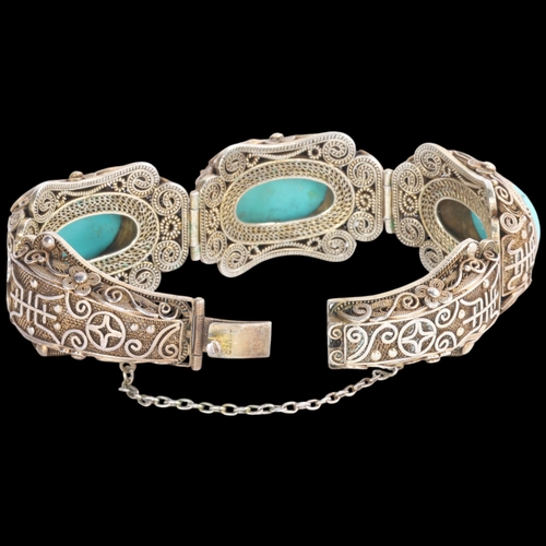 1612 - A Continental silver-gilt turquoise 'Chinoiserie' panel bracelet, unsigned, possibly Erik Poul Fenst... 