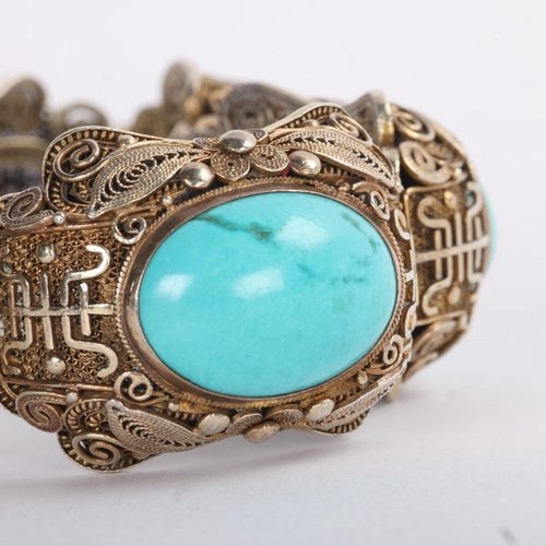 1612 - A Continental silver-gilt turquoise 'Chinoiserie' panel bracelet, unsigned, possibly Erik Poul Fenst... 