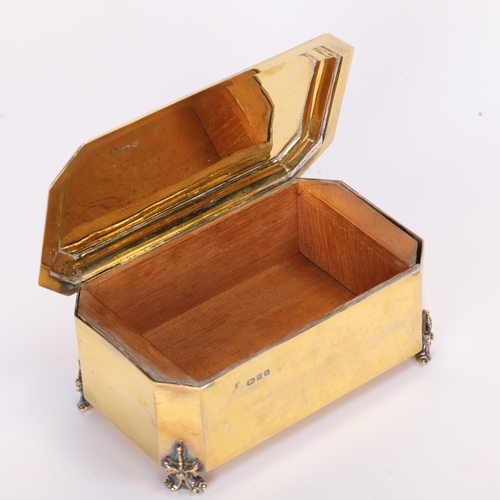 1701 - A fine George V silver-gilt cigarette box, indistinct maker mark with trophy, London 1936, canted re... 