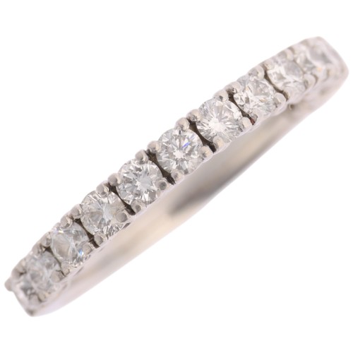 1380 - A platinum diamond half eternity ring, claw set with modern round brilliant-cut diamonds, total diam... 