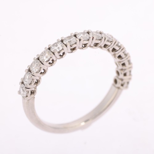1380 - A platinum diamond half eternity ring, claw set with modern round brilliant-cut diamonds, total diam... 