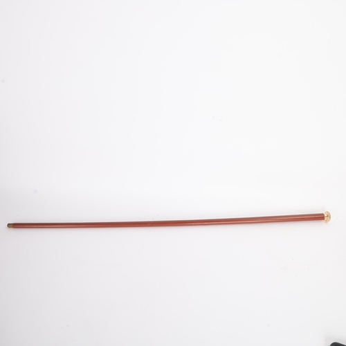 312 - An Antique gilt metal handled with spiral design walking cane, Malacca shaft painted a deep shade of... 